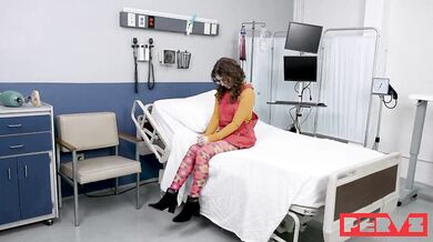 Glasses-wearing Leana Lovings gets a checkup at the doctor's