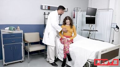 Glasses-wearing Leana Lovings gets a checkup at the doctor's